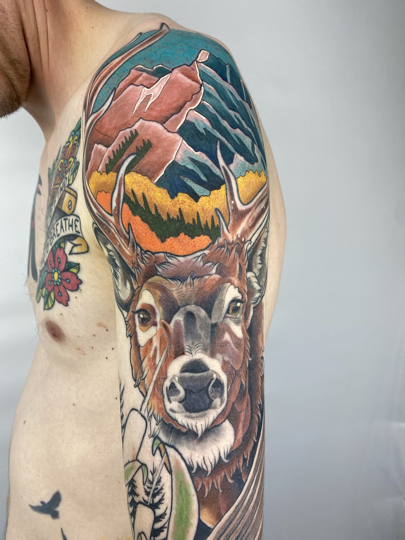 Neo-traditional color deer with a Crested Butte mountain scene in the antlers