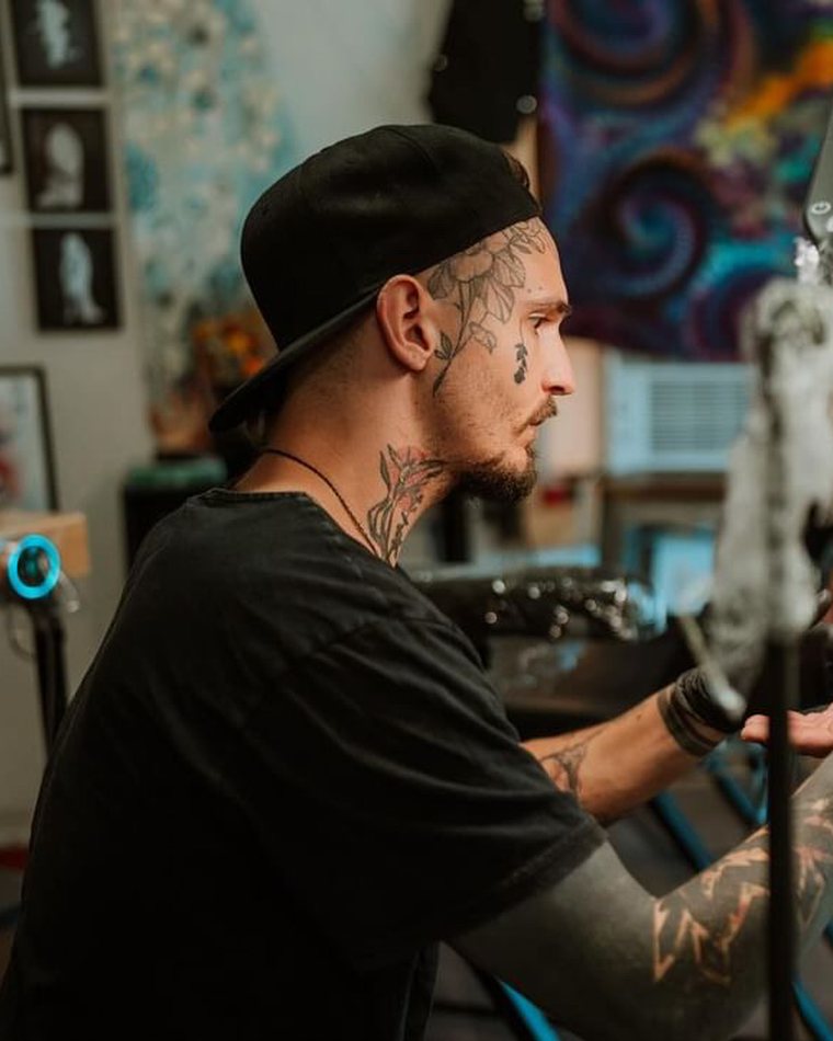Tofer tattooing in the High Nowhere studio