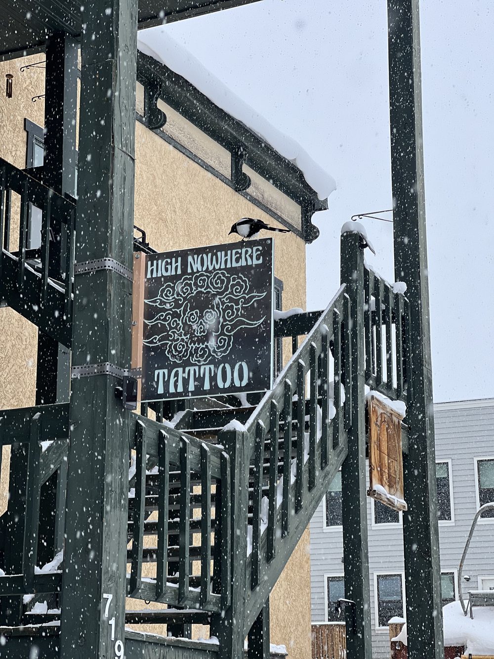 The snowy entrance and staircase at 719 5th Street