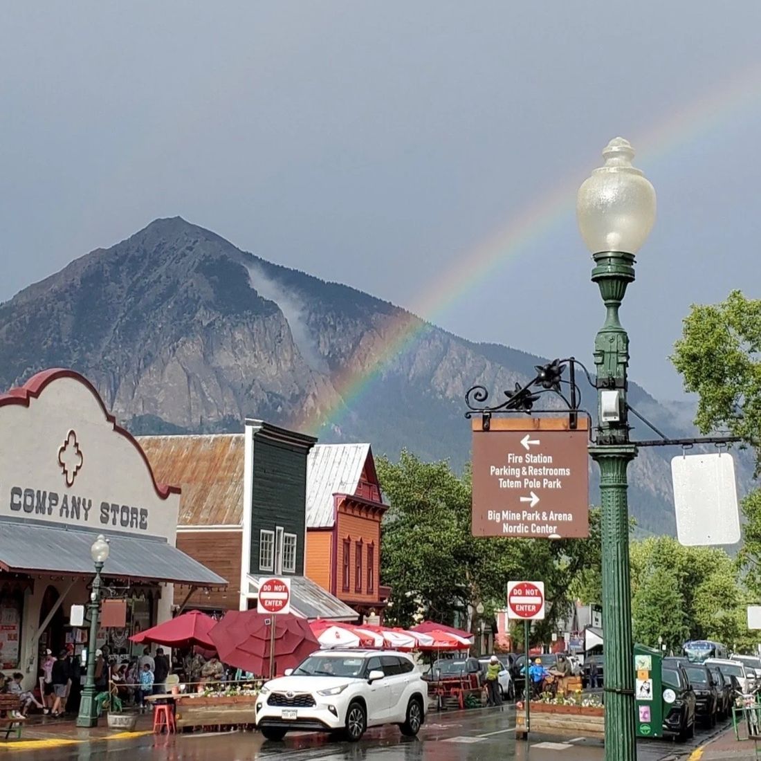 A rainbow over Mt. Crested Butte above the shops on Elk Avenue